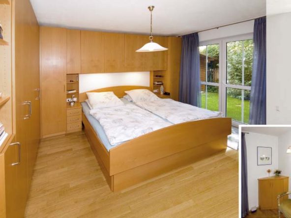 Schlafzimmer mit Bettüberbau, Kleiderschrank über Eck und Doppelbett